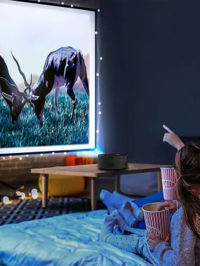 Portable mini projector with built-in speaker
